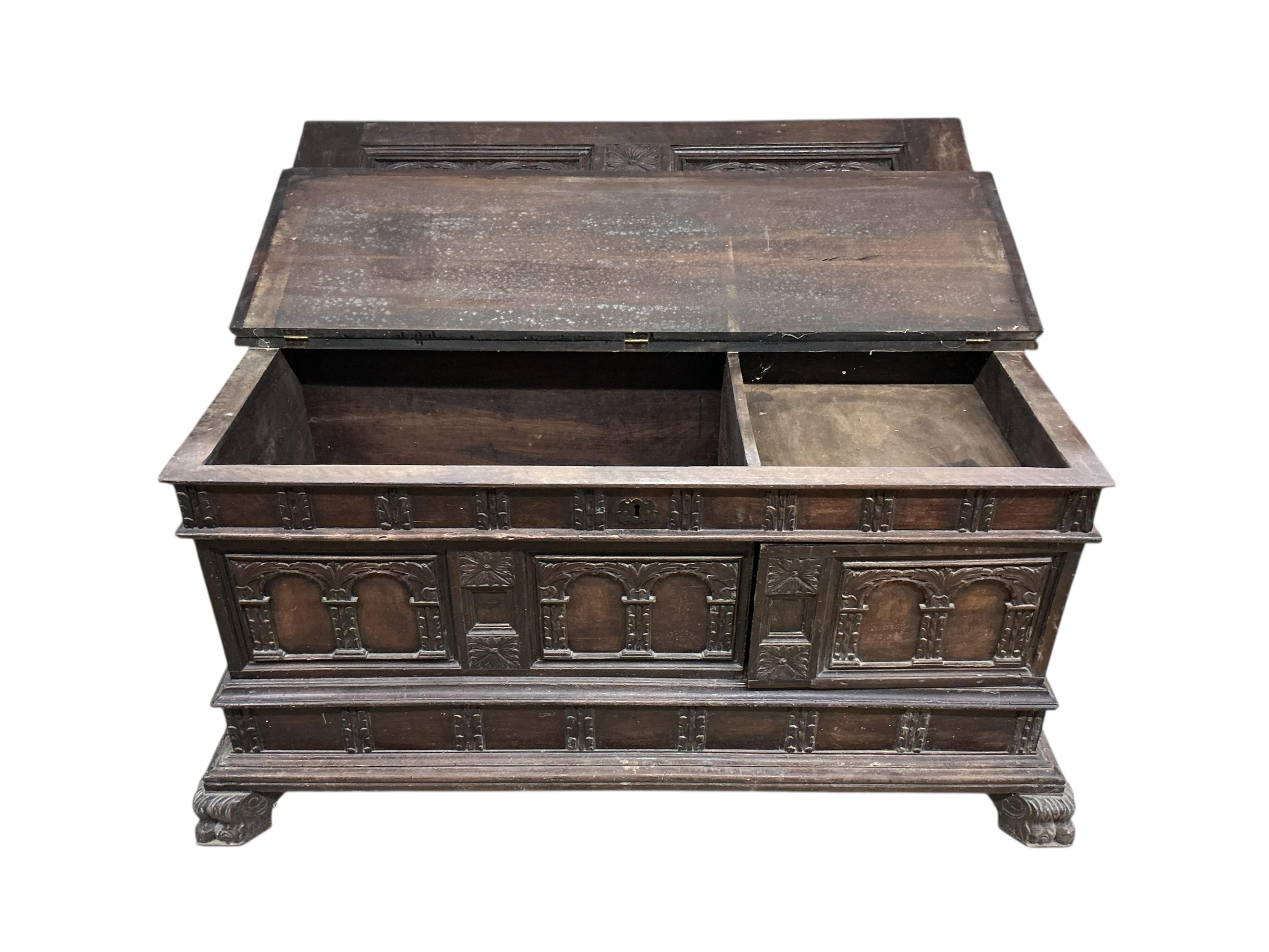 An Italian carved walnut cassone, width 138cm, depth 54cm, height 76cm